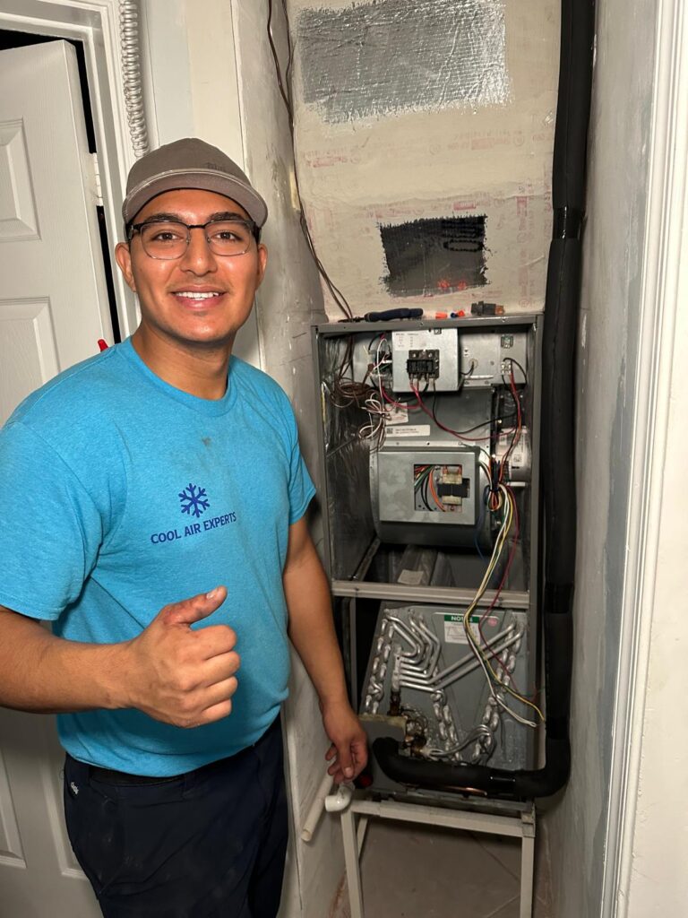 Ac unit being repaired by one of our technicians in Boynton Beach